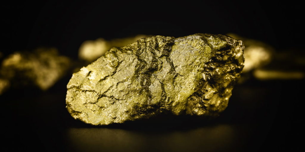 golden rocks on black background