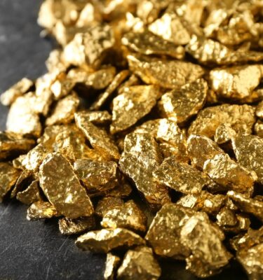 Many gold nuggets on table